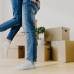 Man lifts partner off the ground to celebrate moving day to illustrate Do Movers Pack For You
