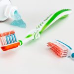 Toothbrushes and opened toothpaste