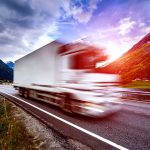 Moving truck blur effect and highway at sunset to illustrate Rental Moving Trucks or Hire a Moving Company What’s best?