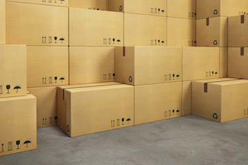 stack of cardboard boxes to illustrate commercial load and unload movers